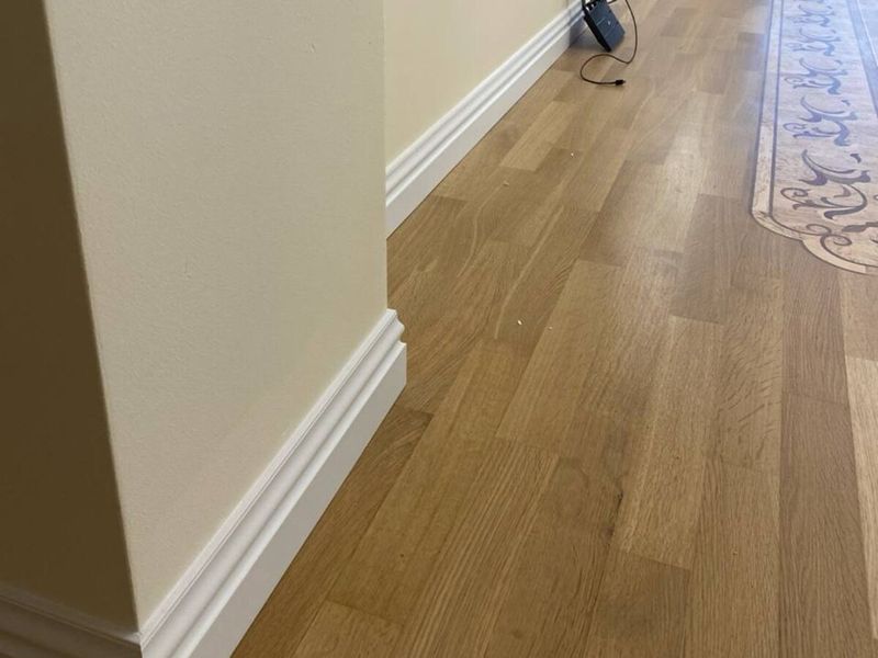 Engineered oak flooring with a white skirting board