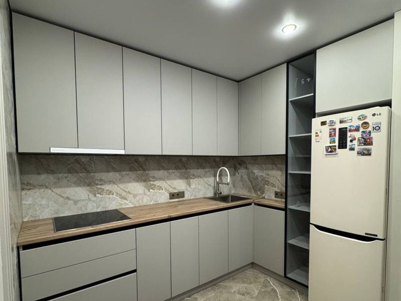 Kitchen with an LED strip lighting the worktop
