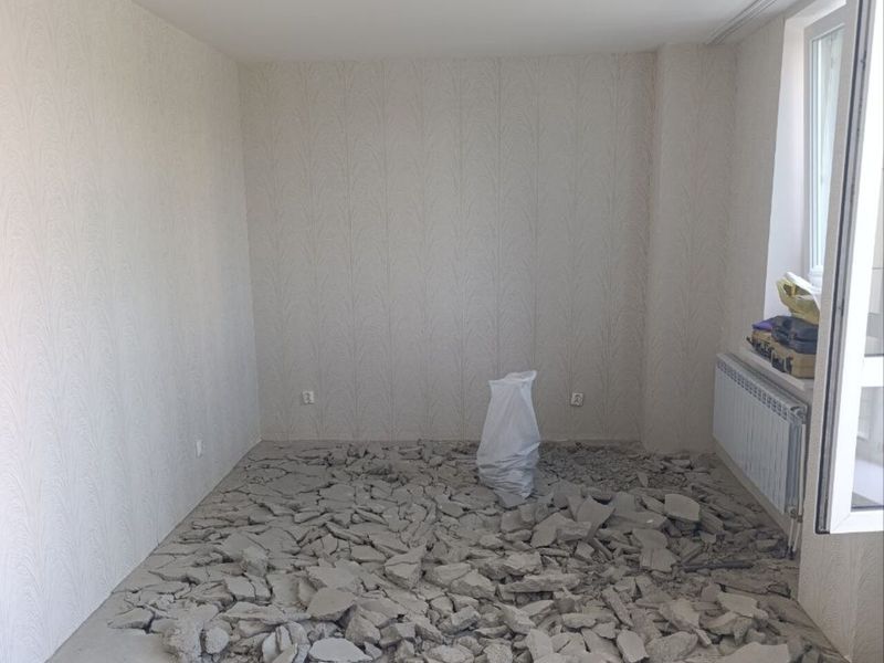 Old floor being stripped out at the start of a Prague flat renovation