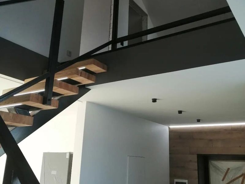 Staircase and open living space in a completed family house